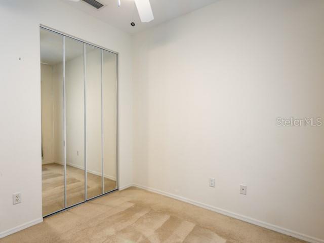 6 Summer Terrace, Unit 6 Palm Coast, FL 32137 - Photo 22 of 30 an empty room with sliding glass door