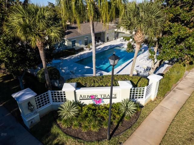 6 Summer Terrace, Unit 6 Palm Coast, FL 32137 - Photo 5 of 30 an outdoor space with seating area and trees