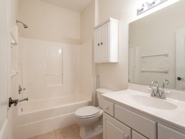 6 Summer Terrace, Unit 6 Palm Coast, FL 32137 - Photo 10 of 30 a bathroom with a sink toilet vanity and shower