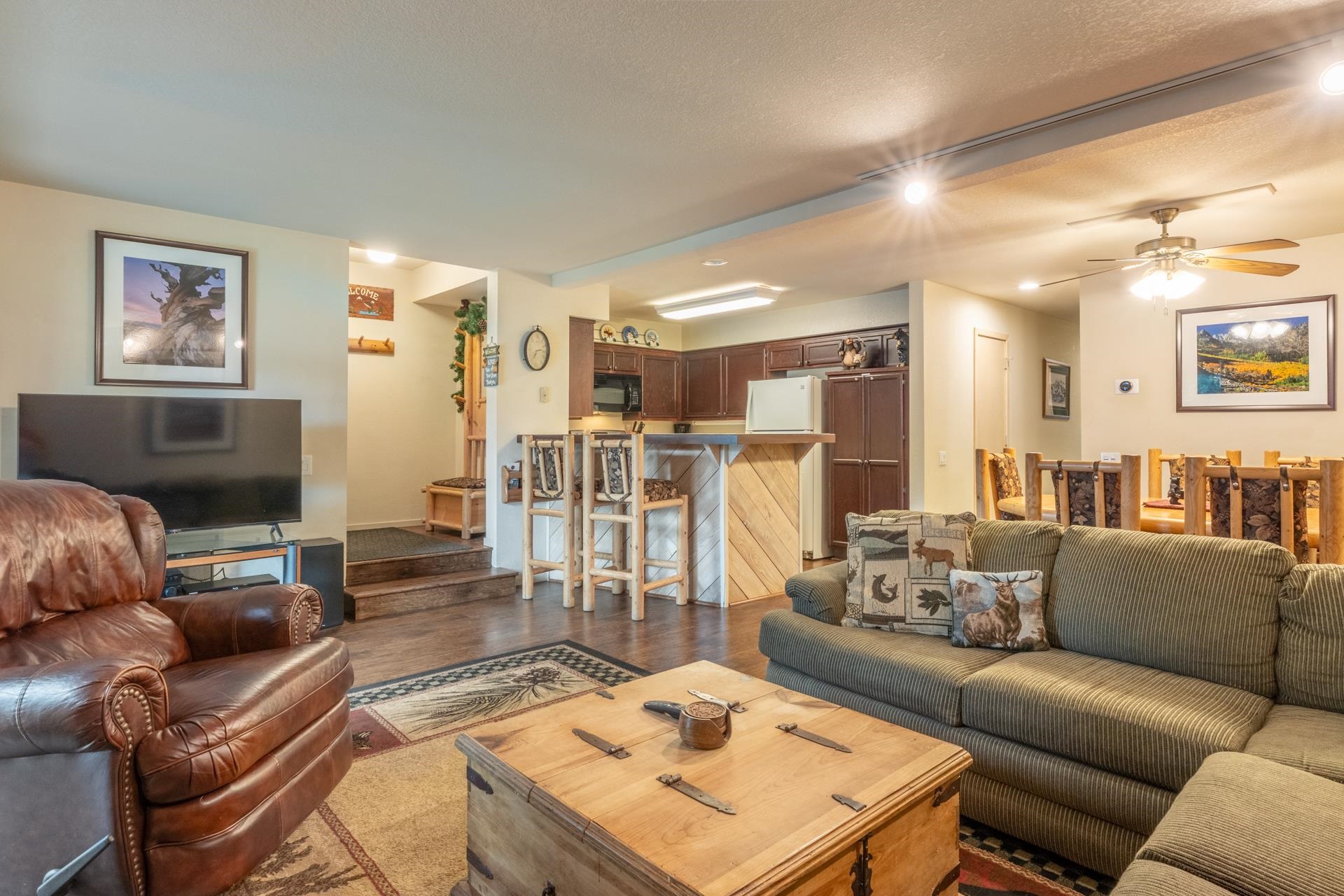 613 Golden Creek Road, Unit 613 Mammoth Lakes, CA 93546 - Photo 7 of 24 Living area with a ceiling fan and dark wood-type flooring