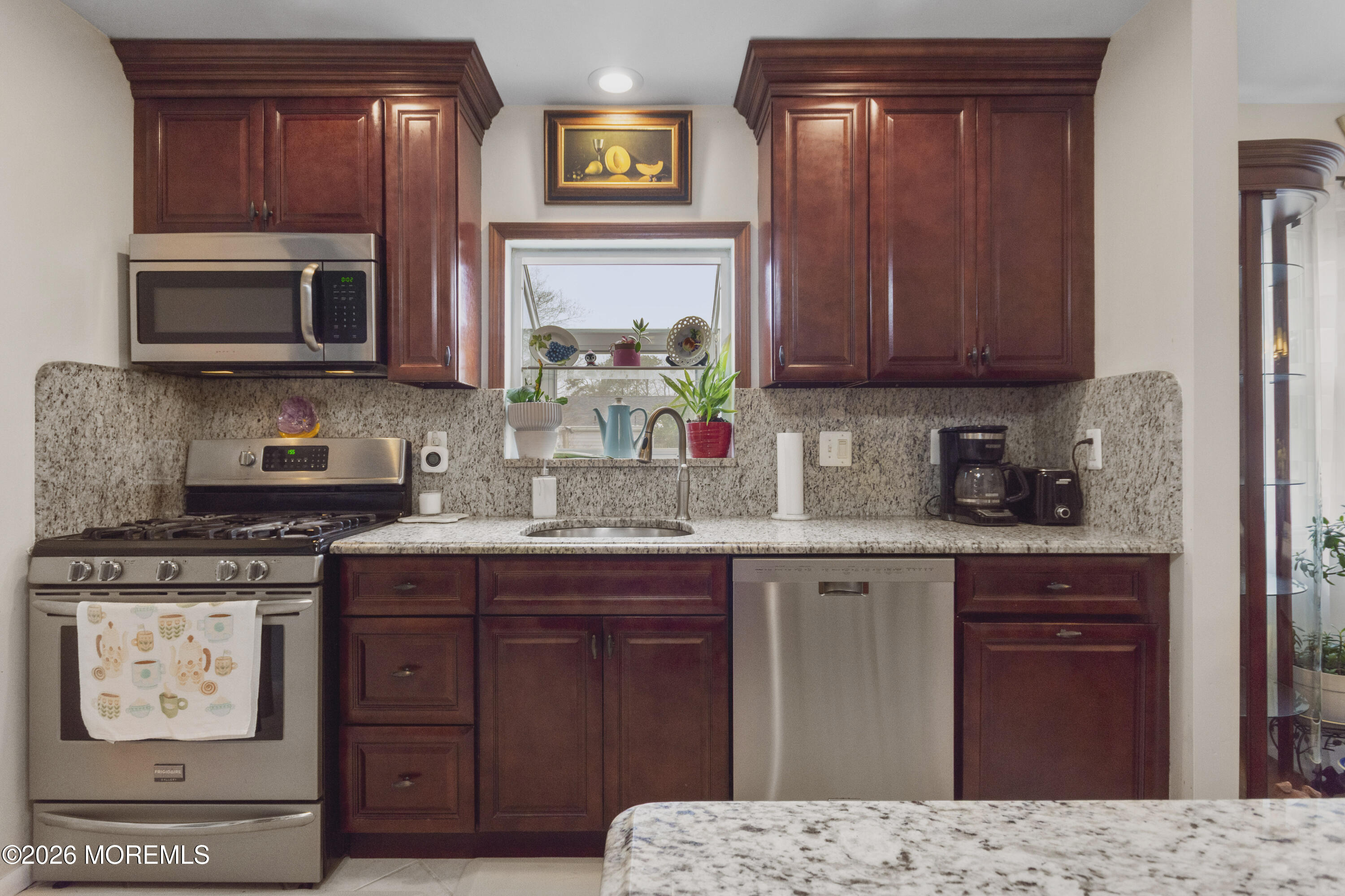 416 Midstreams Road Brick, NJ 08724 - Photo 11 of 27 a kitchen with stainless steel appliances granite countertop a stove top oven a sink dishwasher and a microwave oven with cabinets