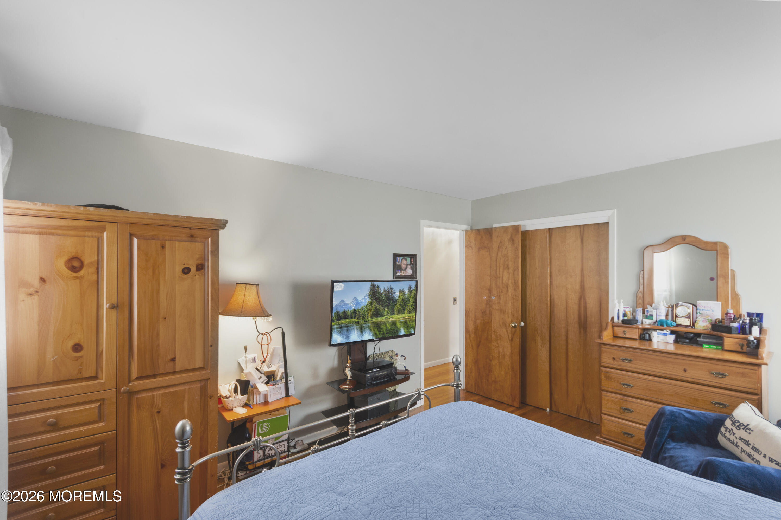 416 Midstreams Road Brick, NJ 08724 - Photo 16 of 27 a bedroom with a bed and a mirror