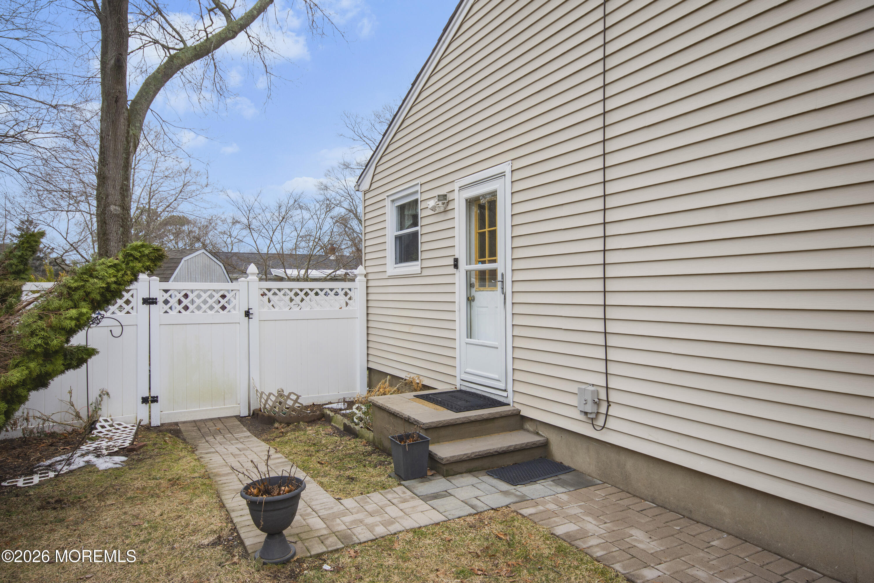 416 Midstreams Road Brick, NJ 08724 - Photo 24 of 27 a white house with a yard and sitting area