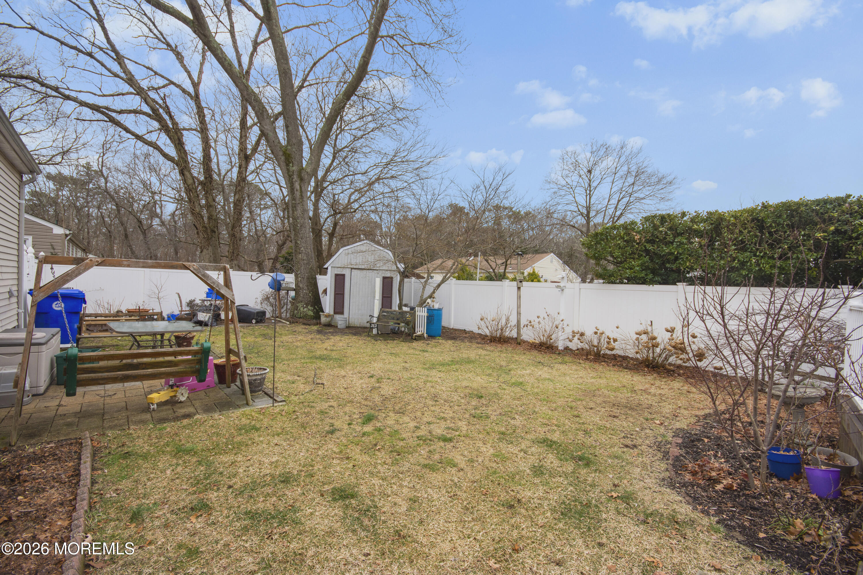416 Midstreams Road Brick, NJ 08724 - Photo 26 of 27 a yellow and red house sitting in the middle of a field