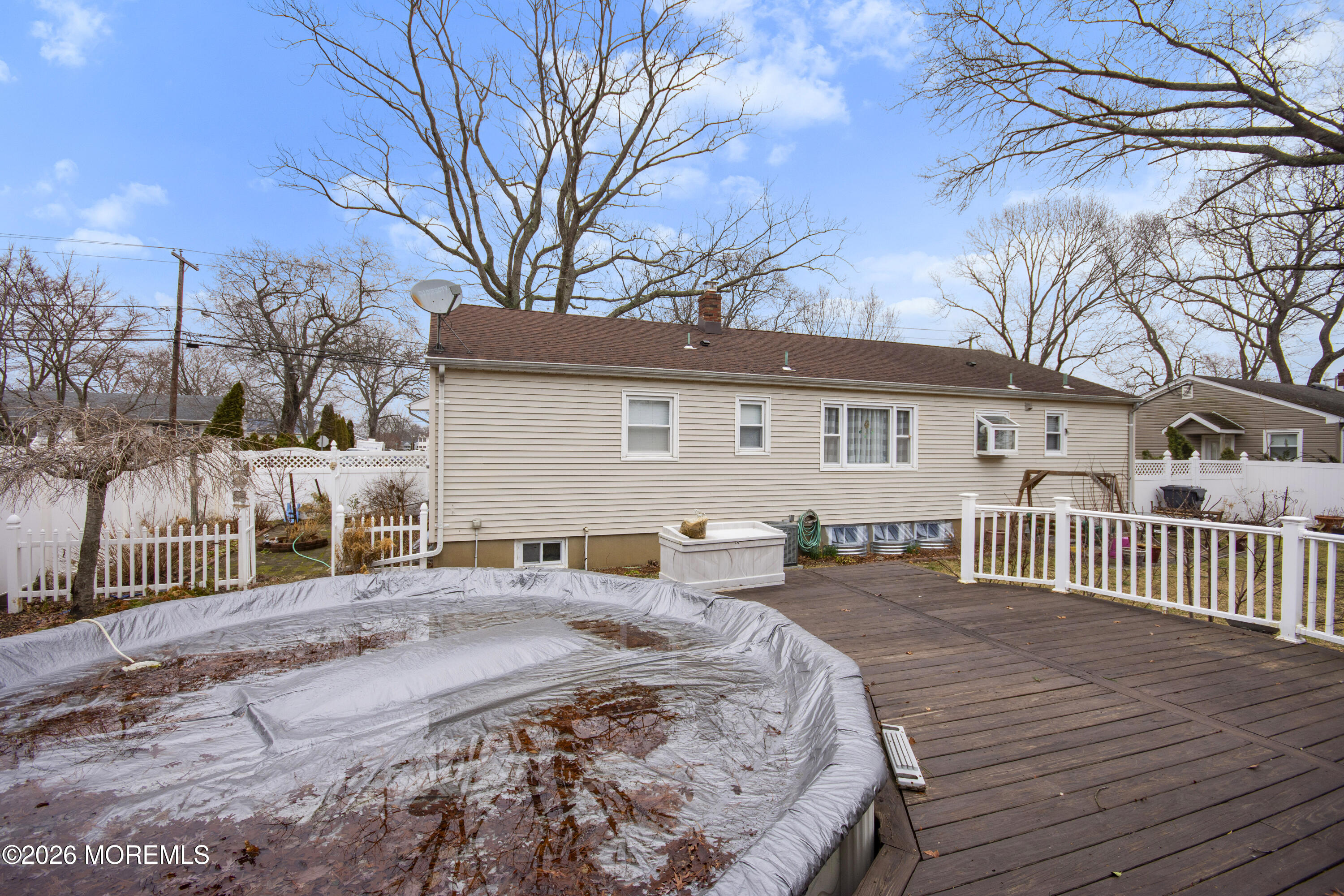 416 Midstreams Road Brick, NJ 08724 - Photo 27 of 27 a wooden bench sitting in front of a house