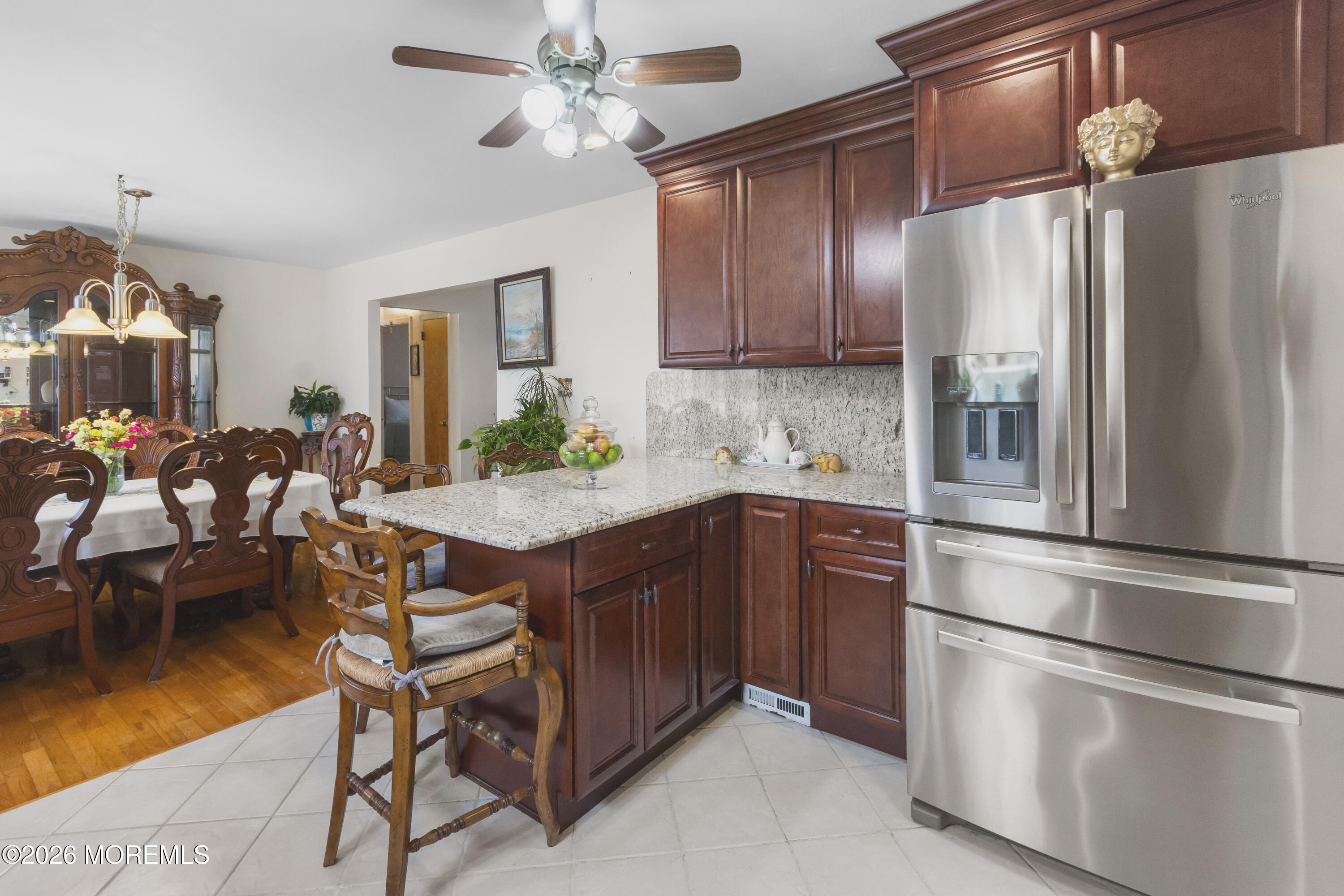 416 Midstreams Road Brick, NJ 08724 - Photo 8 of 27 a kitchen with stainless steel appliances a refrigerator and a dining table