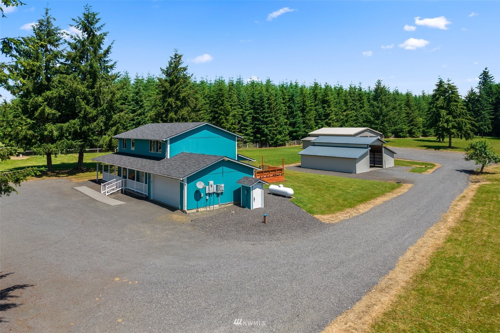 320 Tennessee Road Winlock, WA 98596 - Photo 30 of 40 a house with a yard and a large tree