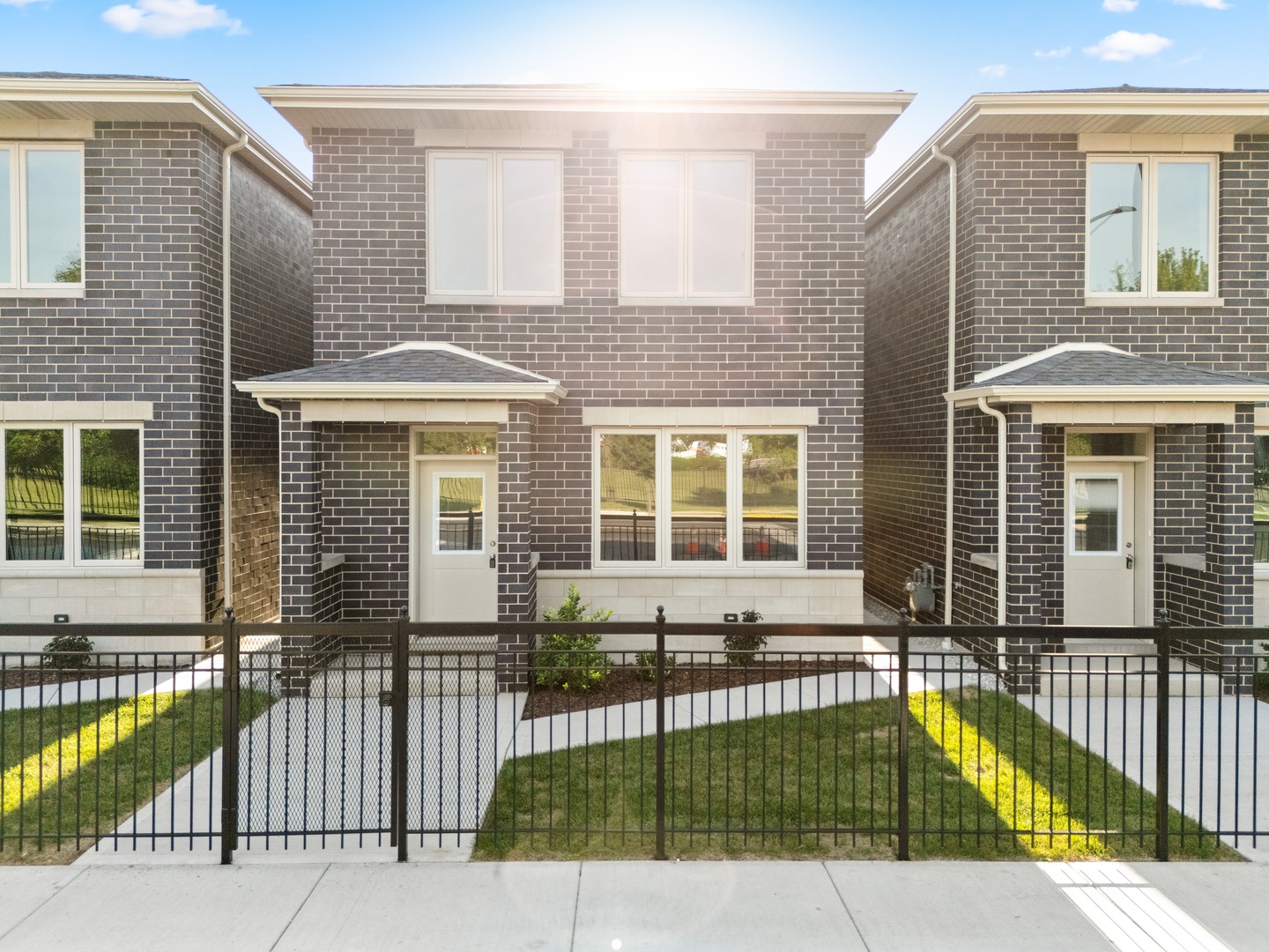 a view of a house with a floor to ceiling window and wooden floor