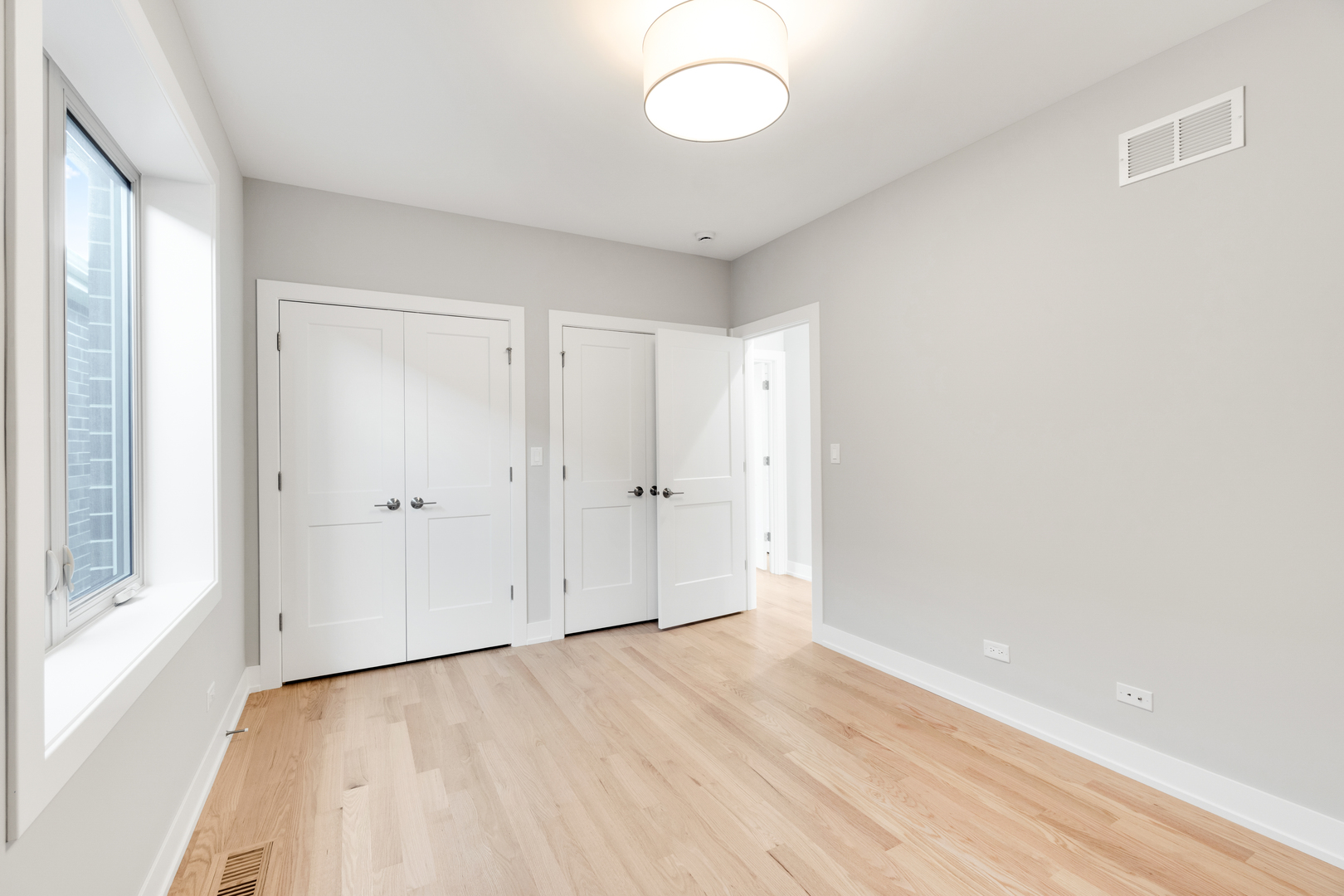 4167 South Halsted Street Chicago, IL 60609 - Photo 21 of 25 a view of a room with wooden floor and windows