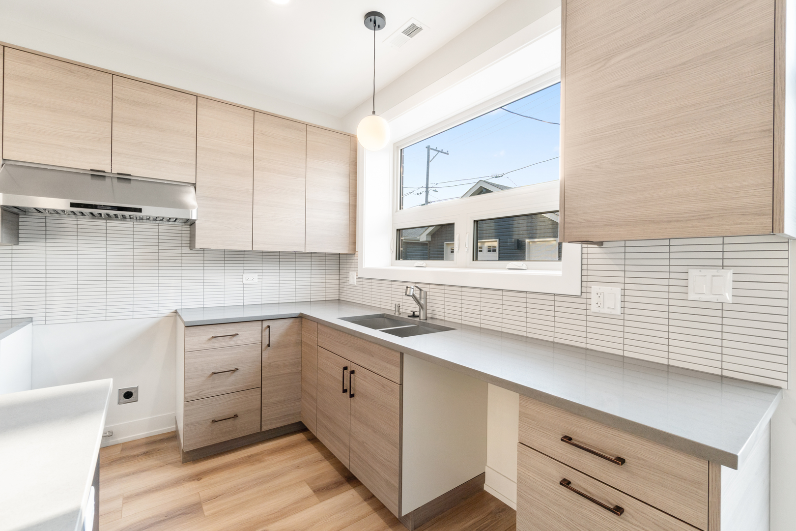 4167 South Halsted Street Chicago, IL 60609 - Photo 6 of 25 a kitchen with a sink a cabinets and window