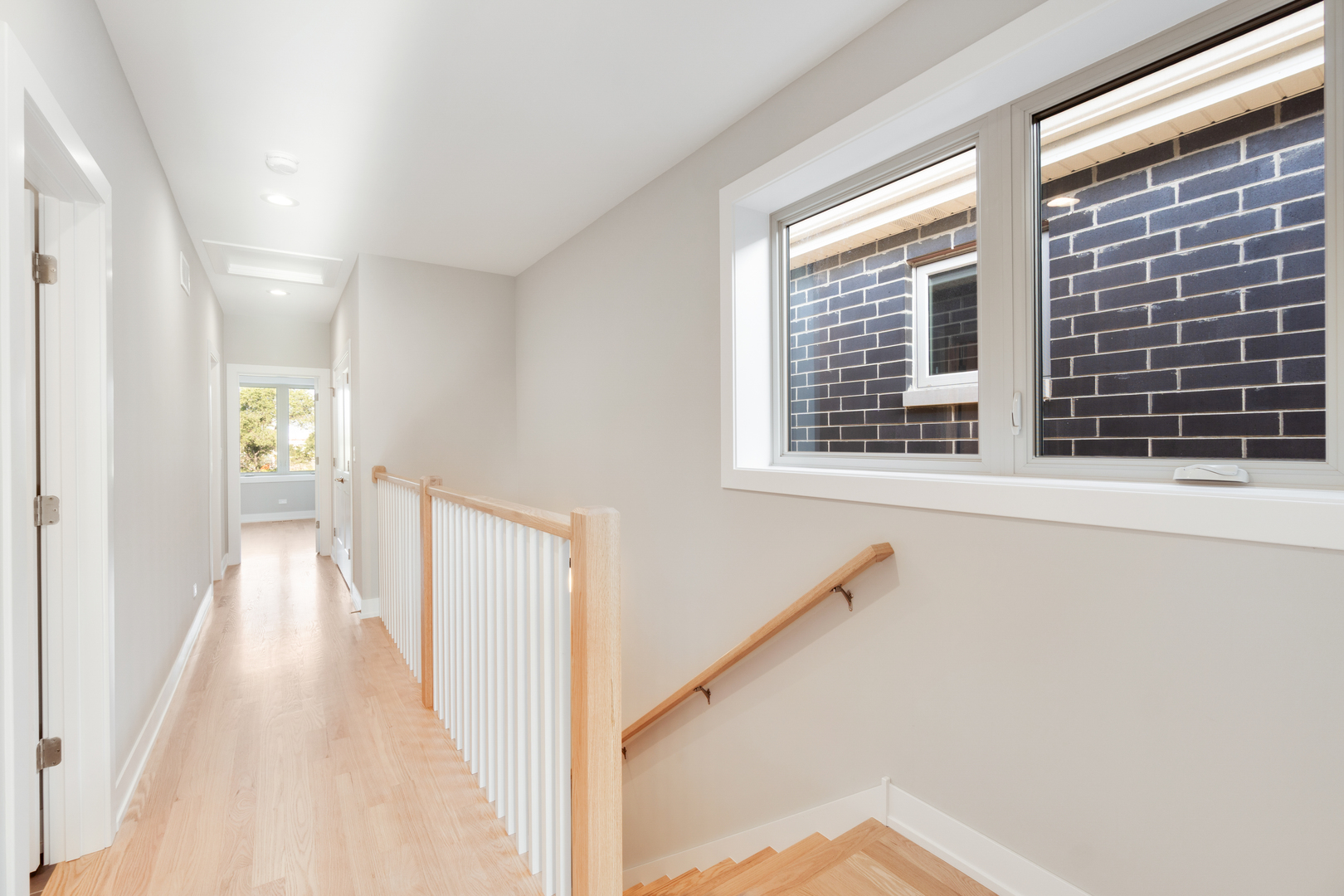 4167 South Halsted Street Chicago, IL 60609 - Photo 10 of 25 a view of a hallway with wooden floor and staircase