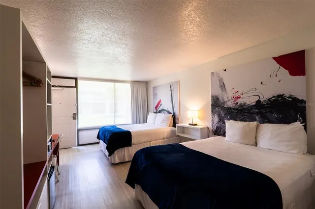 a bedroom with bed and window