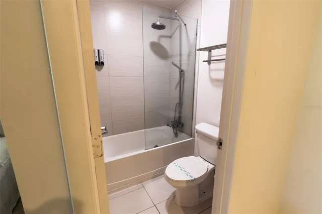 a bathroom with a toilet and shower