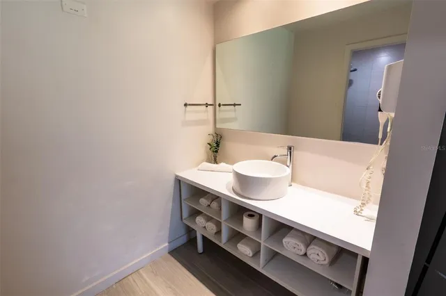 a bathroom with a sink and a mirror