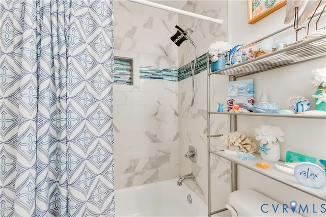 a bathroom with a sink and a shower curtain