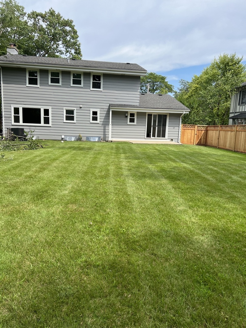 1106 Waukegan Road Deerfield, IL 60015 - Photo 18 of 29 a front view of a house with a yard