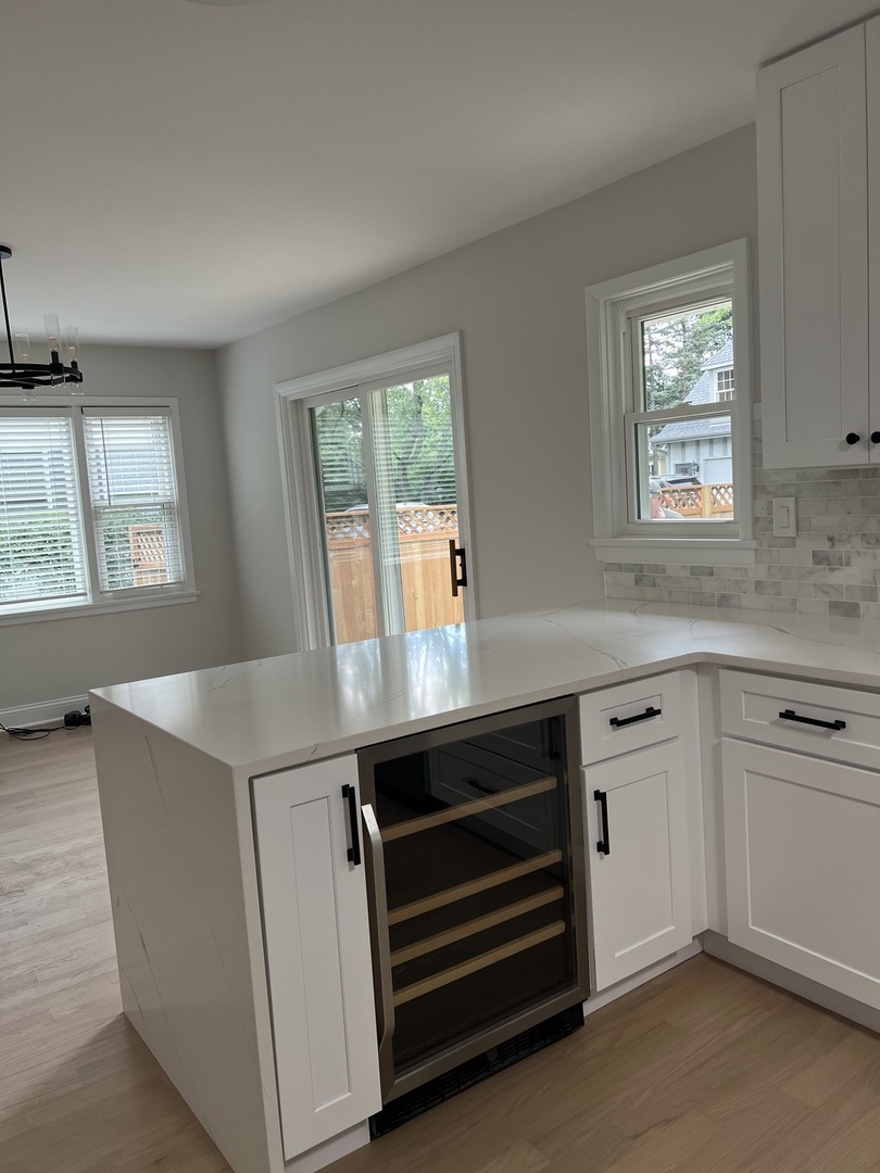 1106 Waukegan Road Deerfield, IL 60015 - Photo 10 of 29 an open kitchen with windows and cabinet
