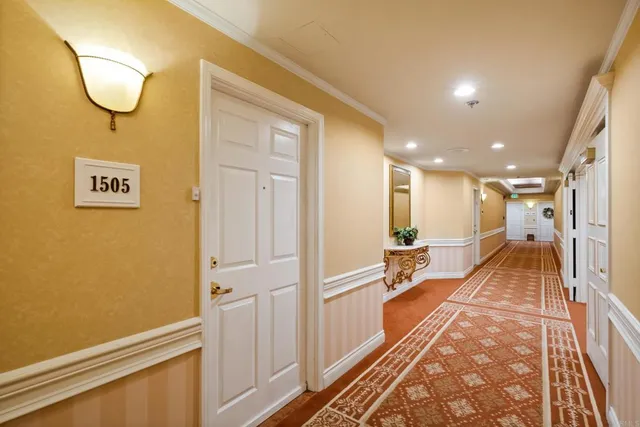 a hallway with a large mirror