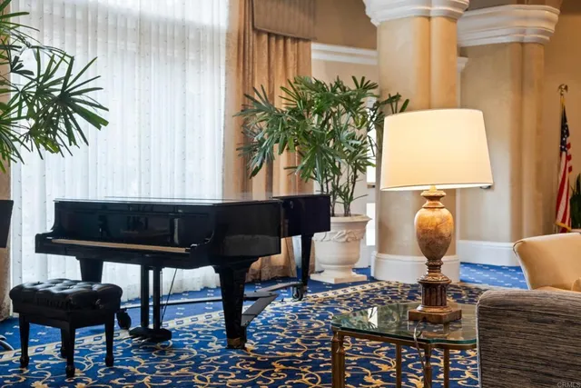 a living room with furniture and a potted plant