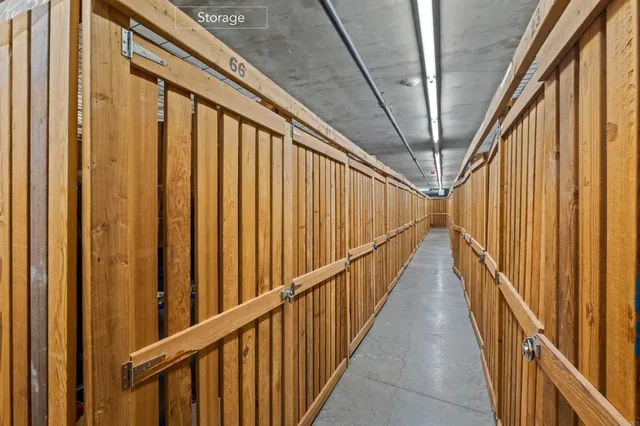 a view of staircase with lots of frames on wall