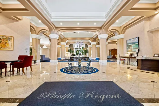 a living room with fireplace and a table