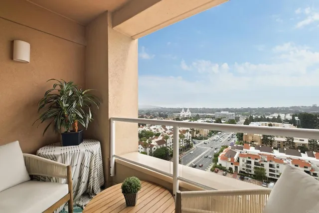 a view of roof deck with furniture