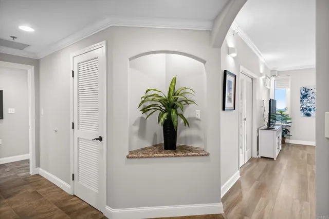 a view of living room with furniture and wooden floor