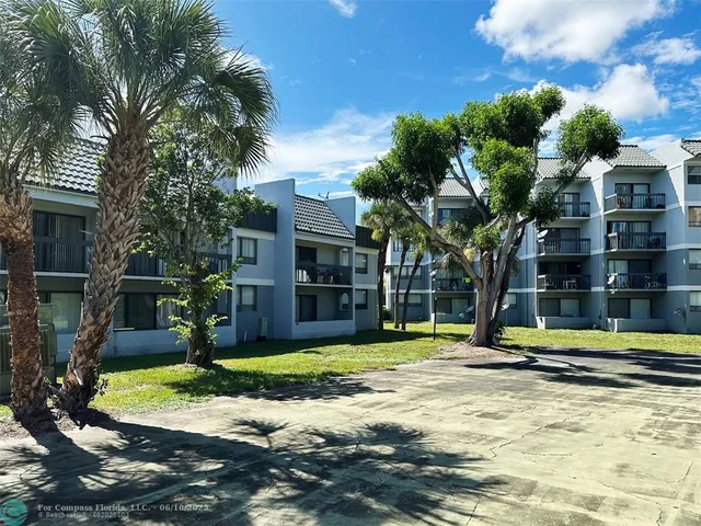 a view of a swimming pool with an outdoor space and seating area