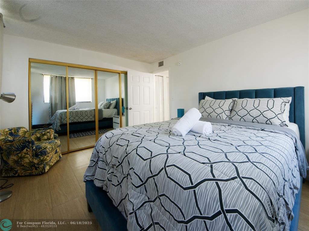 1920 North Congress Avenue, Unit 105 West Palm Beach, FL 33401 - Photo 8 of 19 a bedroom with a bed and a couch