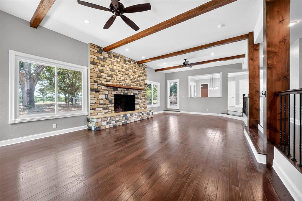 1201 Robbins Road Athens, TX 75751 - Photo 9 of 40 Spacious Living Room Area featuring Stone Woodburning Fireplace
