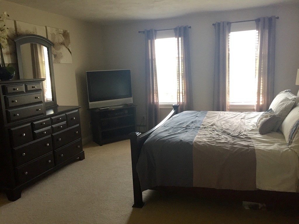 3 Eastern Lane Rutland, MA 01543 - Photo 12 of 22 a bedroom with a bed and a television