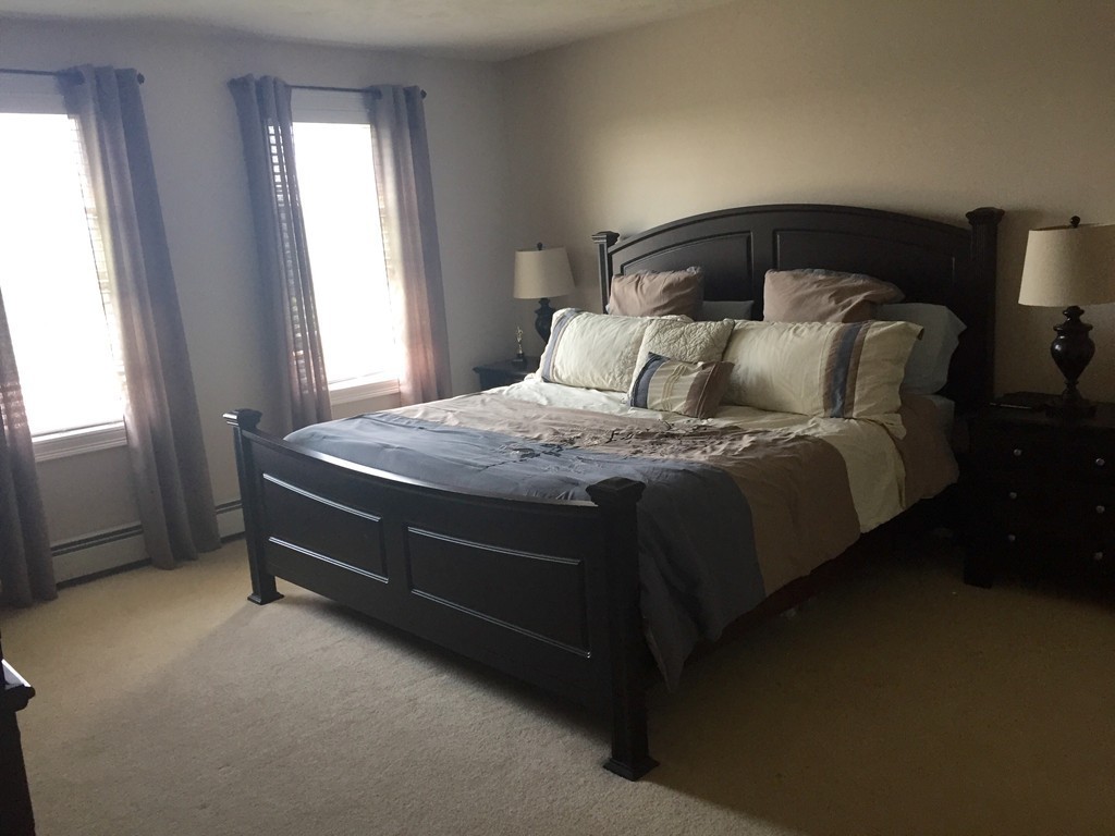3 Eastern Lane Rutland, MA 01543 - Photo 13 of 22 a bed sitting in a bedroom next to a window