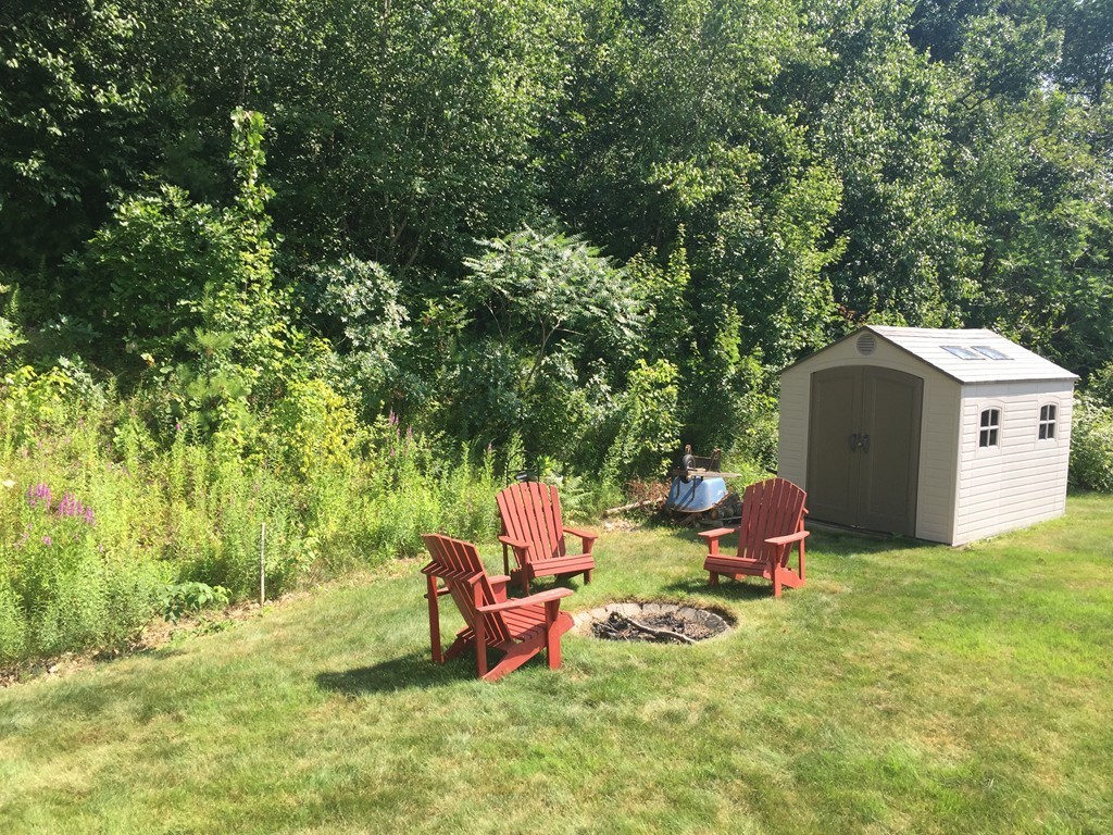 3 Eastern Lane Rutland, MA 01543 - Photo 21 of 22 a backyard of a house with table and chairs