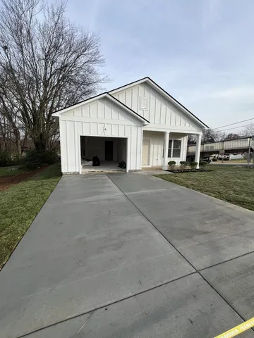 a front view of a house with yard