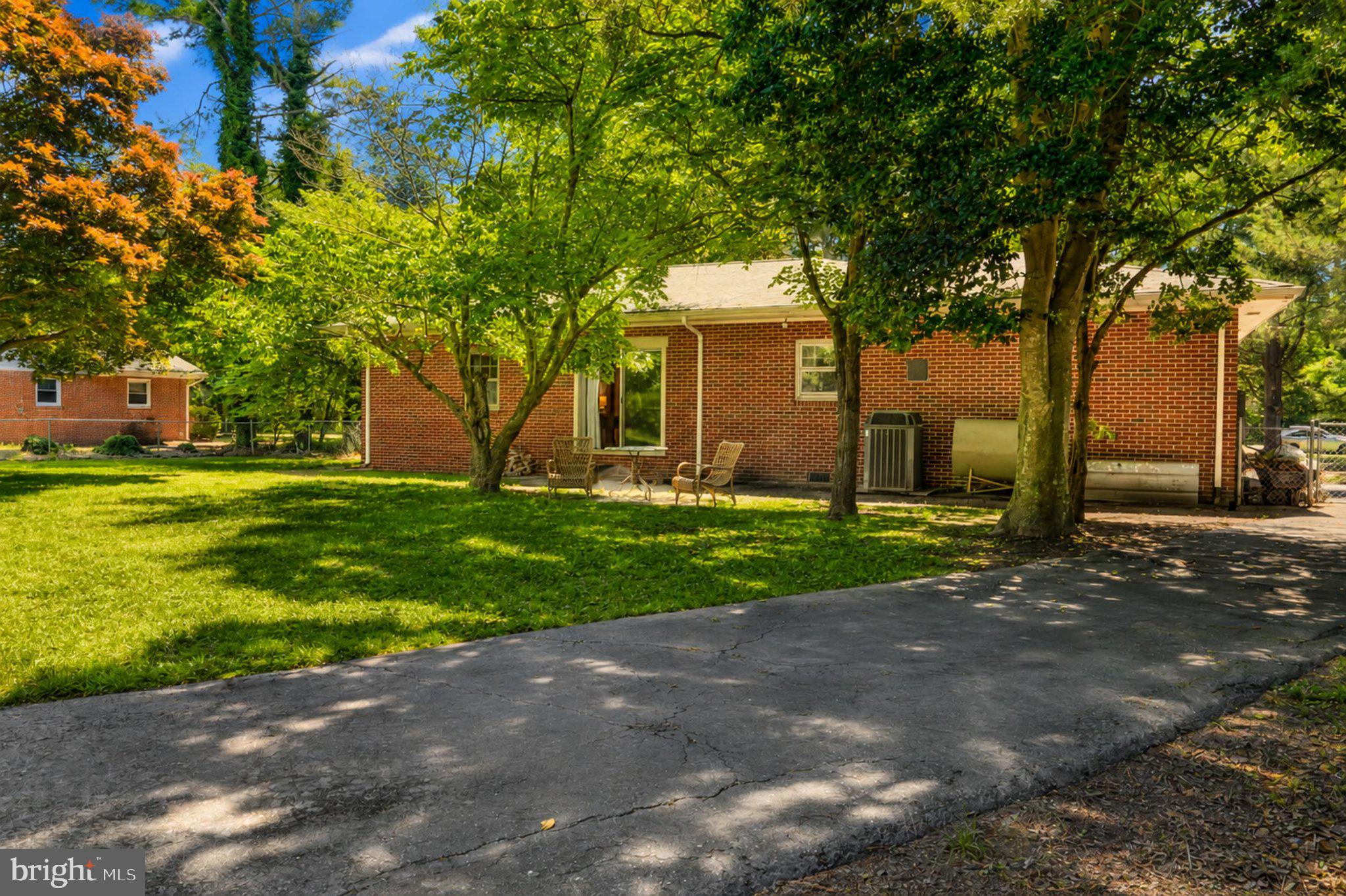 610 Beach Road White Stone, VA 22578 - Photo 15 of 23 Charming brick home in lush greenery.