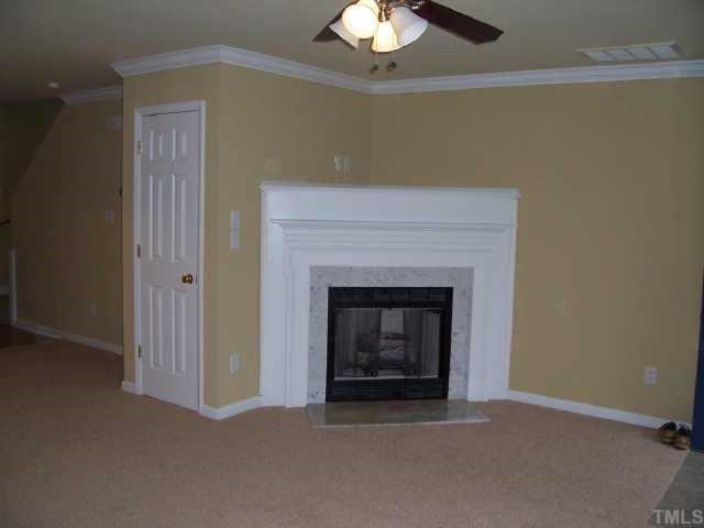 2221 Violet Court Raleigh, NC 27610 - Photo 2 of 9 Family is highlighted by gas log fireplace with entertainment nook, ceramic tile entry, new carpet, new paint, new ceiling fan, smooth ceilings & new crown moulding