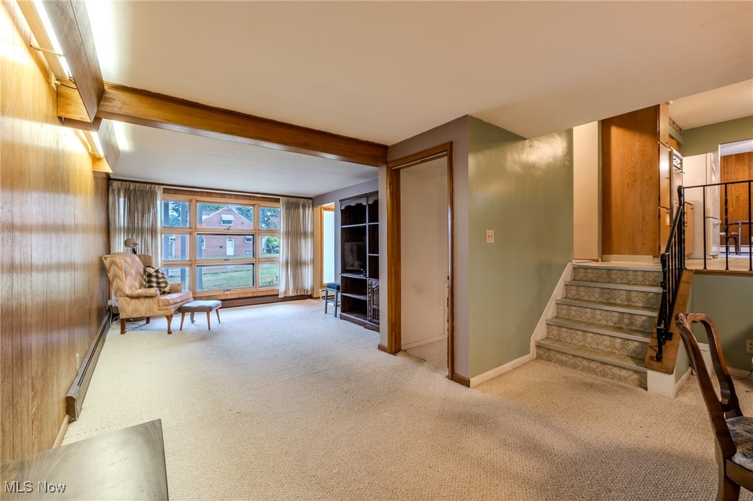 1950 Rush Road Wickliffe, OH 44092 - Photo 41 of 50 Sitting room featuring stairway, a baseboard radiator, carpet flooring, and beamed ceiling