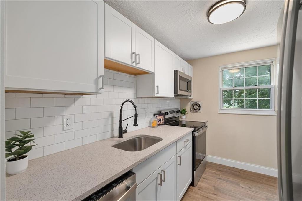 60 Greenleaf Drive Cheswick, PA 15024 - Photo 12 of 29 a kitchen with a sink cabinets and window
