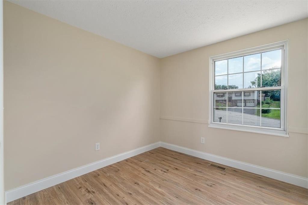 60 Greenleaf Drive Cheswick, PA 15024 - Photo 17 of 29 wooden floor in an empty room with a window