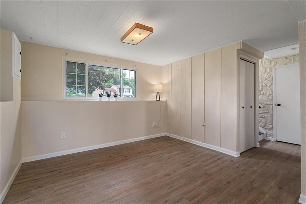 60 Greenleaf Drive Cheswick, PA 15024 - Photo 21 of 29 a view of an empty room with wooden floor and a window