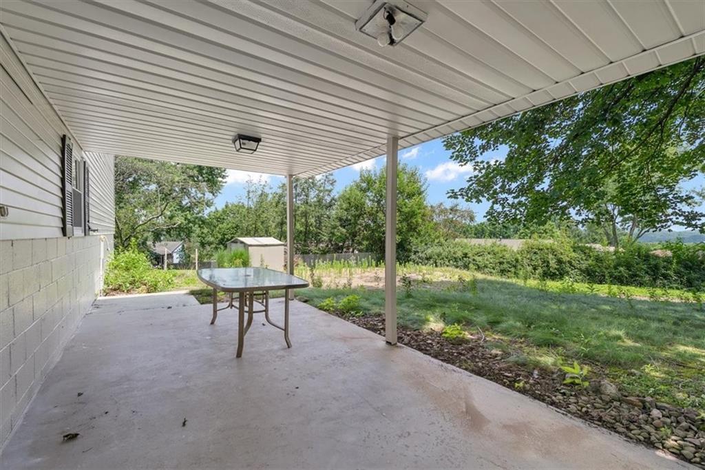 60 Greenleaf Drive Cheswick, PA 15024 - Photo 25 of 29 a view of a patio with a table chairs and backyard
