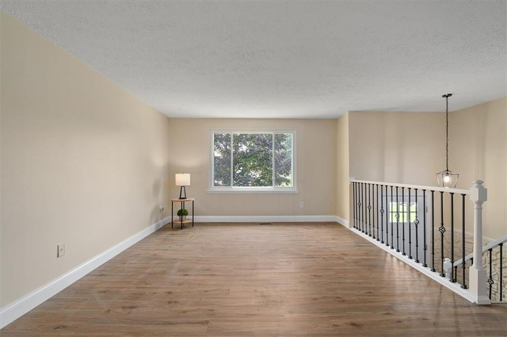 60 Greenleaf Drive Cheswick, PA 15024 - Photo 6 of 29 a view of an empty room with wooden floor and a window
