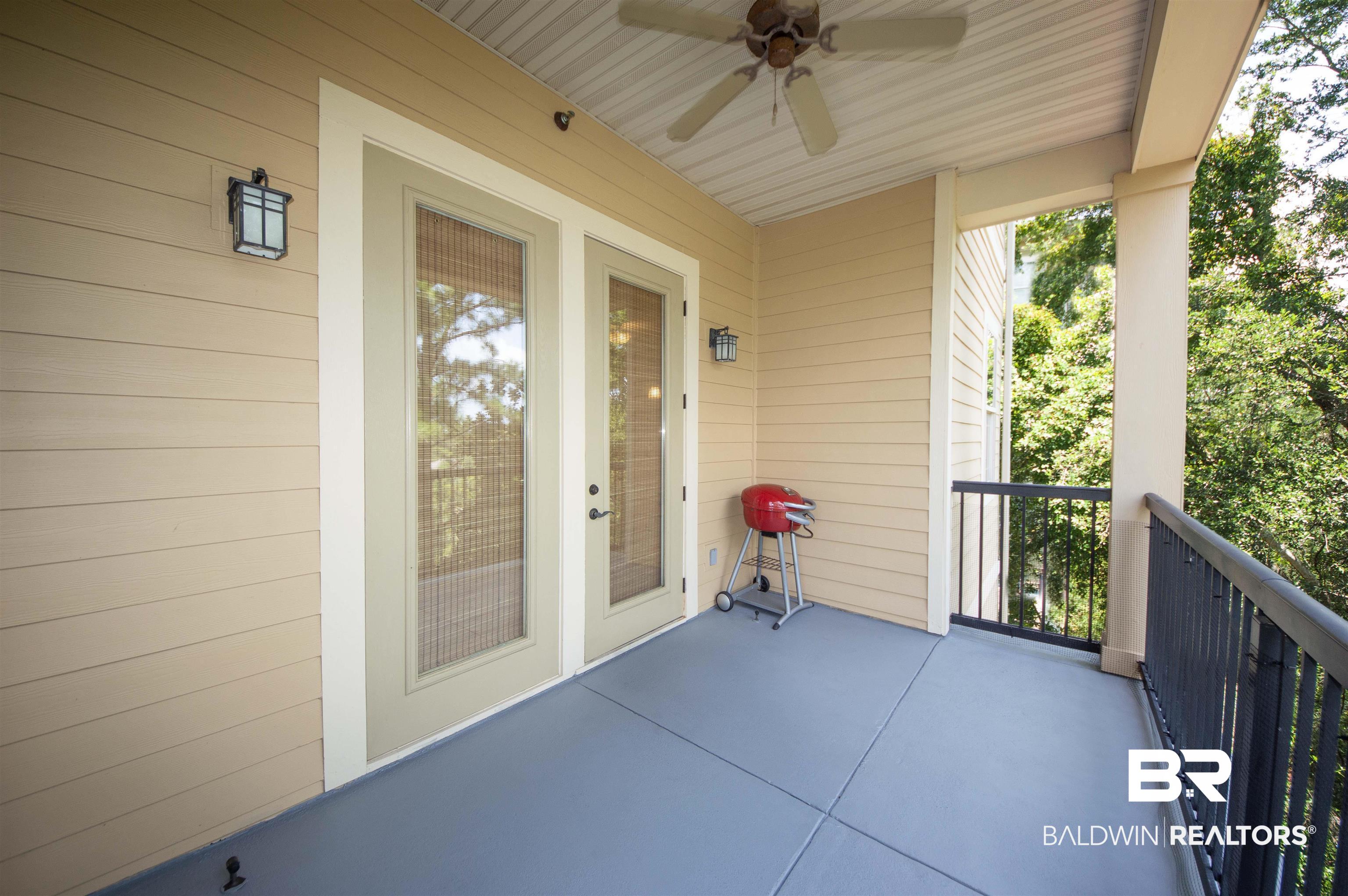 1430 Regency Road, Unit 301C Gulf Shores, AL 36542 - Photo 9 of 22 Balcony with ceiling fan