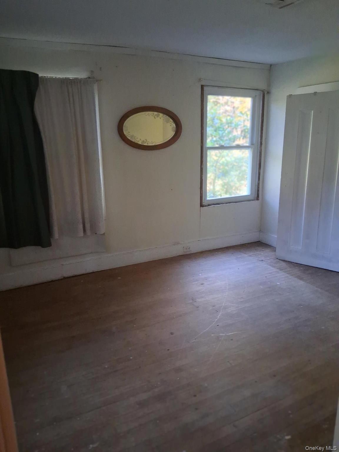 84 N Road Red Hook, NY 12571 - Photo 11 of 22 Unfurnished room with baseboards and hardwood / wood-style floors
