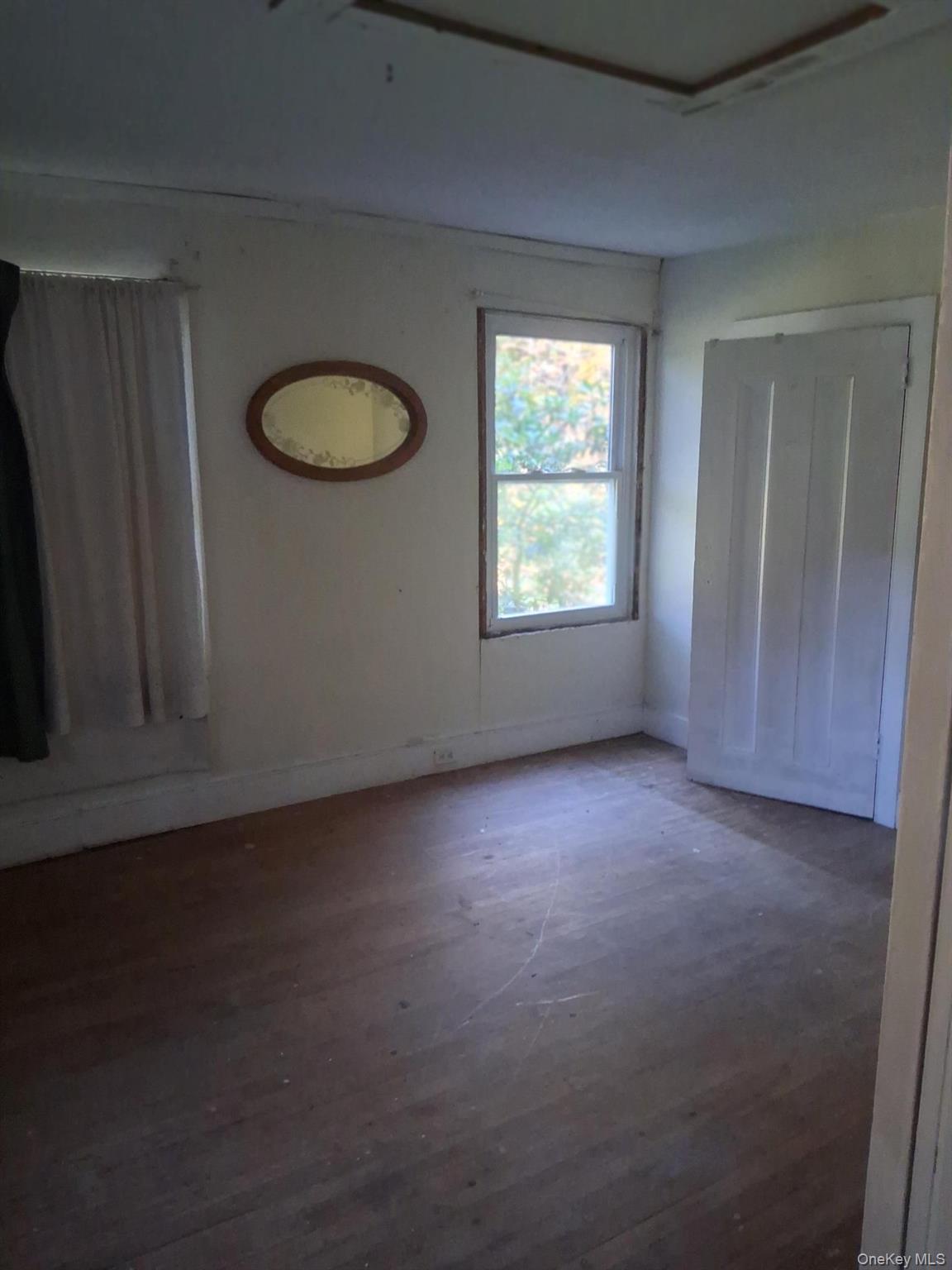 84 N Road Red Hook, NY 12571 - Photo 14 of 22 Spare room with baseboards and dark wood-style flooring
