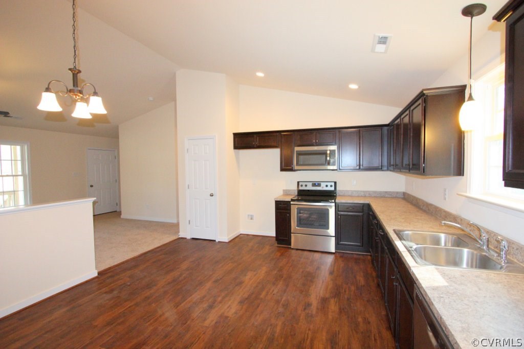 315 Winding Ridge Way Bumpass, VA 23024 - Photo 8 of 18 a kitchen with stainless steel appliances granite countertop a sink a stove and a refrigerator