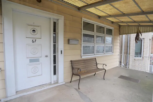 a view of front door and wooden door