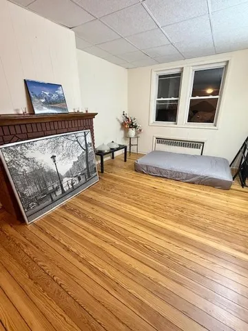 a view of a livingroom with furniture and staircase
