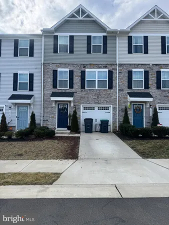 a front view of a house with yard