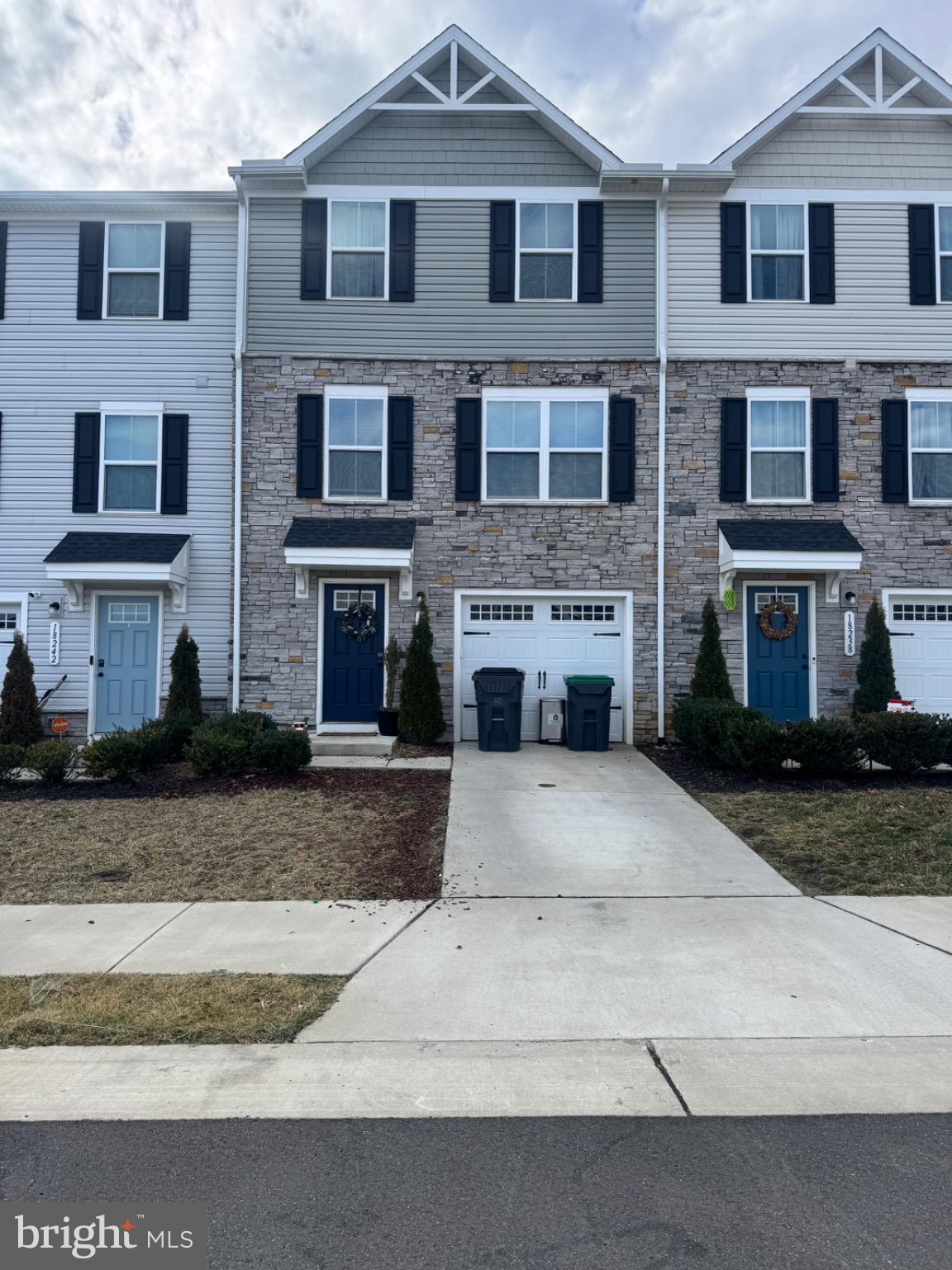 a front view of a house with yard